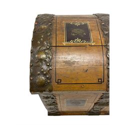 19th century painted oak sea chest, hinged dome top enclosing small compartment, bound by shaped and pressed metal strapwork, scumbled finish to resemble oak and painted with small vignettes depicting portraits and landscapes within panels, fitted with large wrought metal carrying handles, the front inscribed 'H.J.S. 1870' 