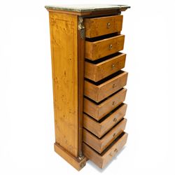 Neoclassical marble and inlaid figured maple wood tall chest, green marble inverted-breakfront top over eight long drawers, flanked by square tapering pilasters with gilt metal female bust and anthemion leaf capitals and brass feet terminals, the skirted base with applied Medusa gilt metal mounts, on compressed bun feet
