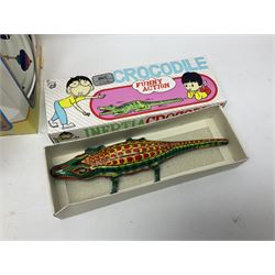 Twenty six tinplate models to include Ferris Wheel and Performing Circus Elephant, marked JW, further similar examples such as Duck on a Bike, Clown on Roller, Carousel; Popeye Tin Speedboat; Looney Tunes Wind Up Cars and Express Train; various international examples, MS107 Jumping Bambi, Pop Pop Boat, jumping frogs, pecking chickens etc; both boxed and loose