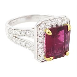 18ct white gold rubellite tourmaline and diamond cluster ring, single octagonal cut tourmaline of 4.05 carat, four claw set in yellow gold, surrounded by  round brilliant cut diamonds, with split diamond set shoulders, London 2013, total diamond weight 1.24 carat