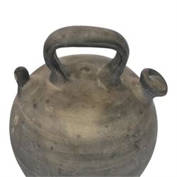 Four 20th century Spanish blackened earthenware botijo or cruche vessels, each of typical baluster form with central loop handle and opposing spout, impressed marks to handles, tallest example H31cm