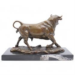 Bronze figure, modelled as a prancing bull, upon a rectangular marble base, bearing foundry stamp, overall H14cm L21cm
