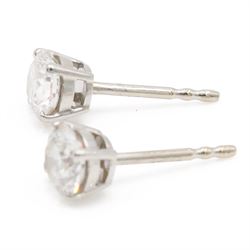 Pair of platinum diamond earrings, each stud set with a single round brilliant cit diamond, hallmarked, total diamond weight approx 1.50 carat