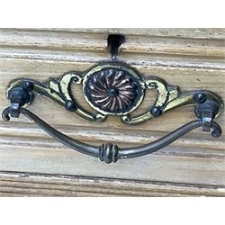 Late 19th century ash combination wardrobe, projecting cornice over foliage carved frieze, the left-hand upright enclosed by mirror glazed door, the right-hand side fitted with double panelled cupboard over two short and three long drawers, the upper panels carved with curled leaves and central scroll cartouche, on bracketed plinth 