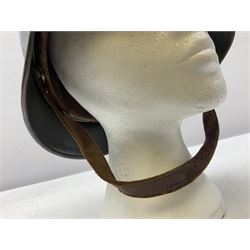 WW2 German steel helmet painted in undecaled Luftwaffe bluey grey with leather liner and chin strap stamped '58', the skirt impressed '1250'