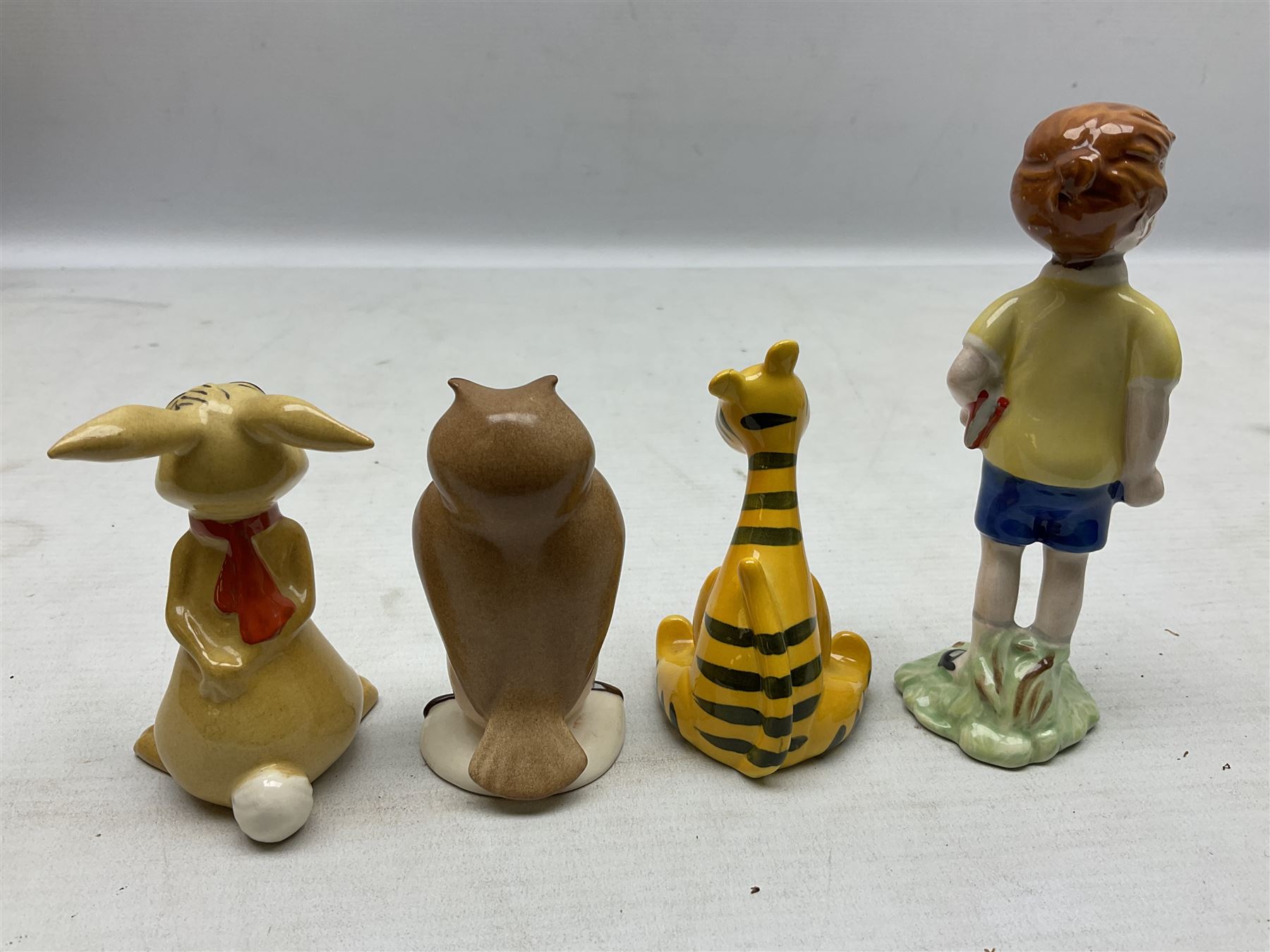 Set of eight Winnie the Pooh Beswick figures, comprising Christopher Robin, Winnie the Pooh, Tigger, Piglet, Rabbit, Eeyore, Owl and Kanger, six with original boxes, tallest H12cm  