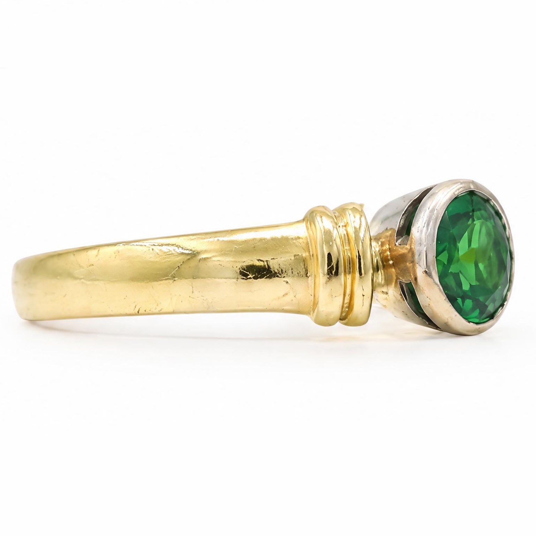 18ct gold tsavorite garnet ring, bezel set with a single round cut garnet, Birmingham 1992