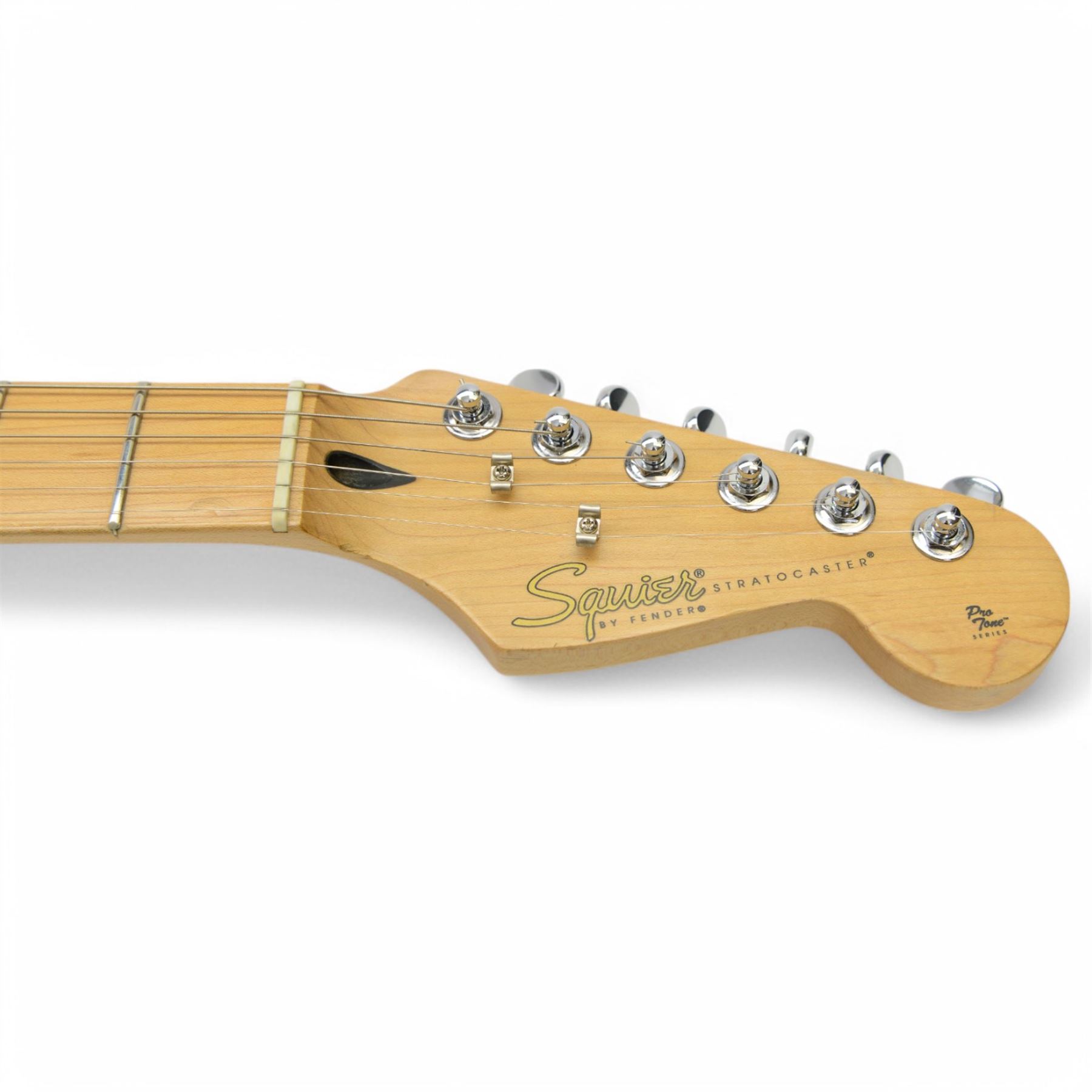 Squier by Fender Pro Tone Series Stratocaster electric guitar, in Olympic White finish, made in Korea serial no. 7034880, contained within a Fender soft case, guitar L98cm