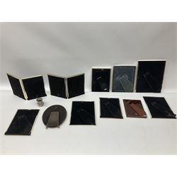 Collection of silver plated and metal mounted photograph frames, comprising one oval example, two folding examples with twin apertures, seven rectangular examples, and one with cream finish surround, largest overall H26cm W21cm, in one box