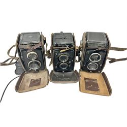 Franke & Heidecke Rolleiflex twin lens camera, serial number 441347, with 'Heidoscop-Anastigmat 1:3.1 f=7.5cm' lens, serial number 433505 and a 'Tessar1:35f=7.5cm' lens, serial number 1744185, together with two Rolleicord DRP twin lens cameras, all within leather carrying cases 