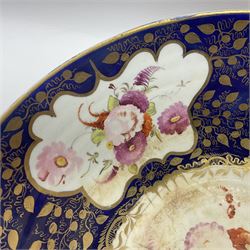 19th century continental bowl, decorated with hand painted floral sprays amongst gilt foliate decoration on a cobalt blue ground, D27.5cm