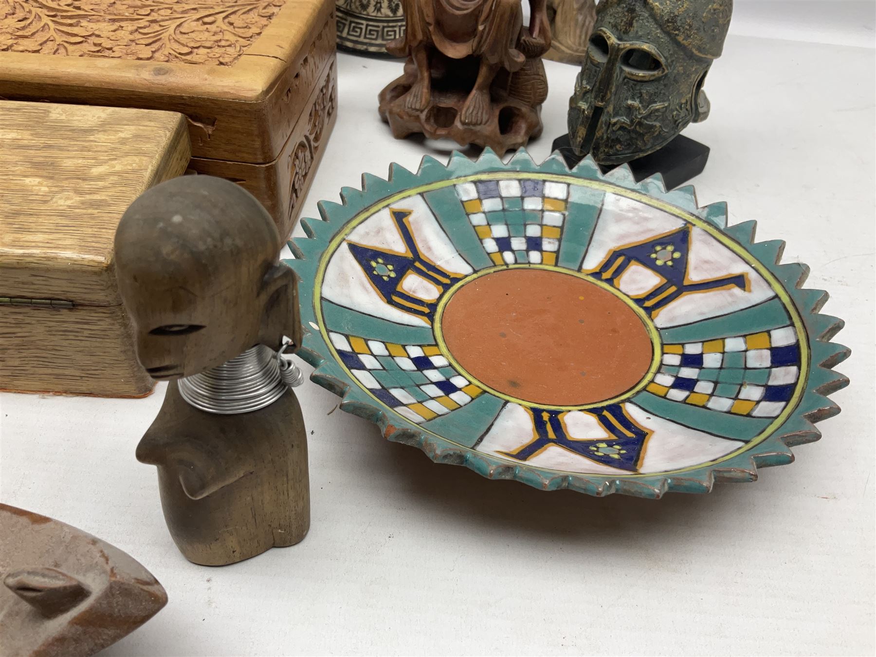 Two Greek Kerameikos plates together with a Kepamik plate and other Grecian style ceramics, carved African figures and treen, boxes etc 