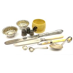 Cabinet items including two hallmarked silver thimbles, silver butter knife the handle and blade both hallmarked and other similar items