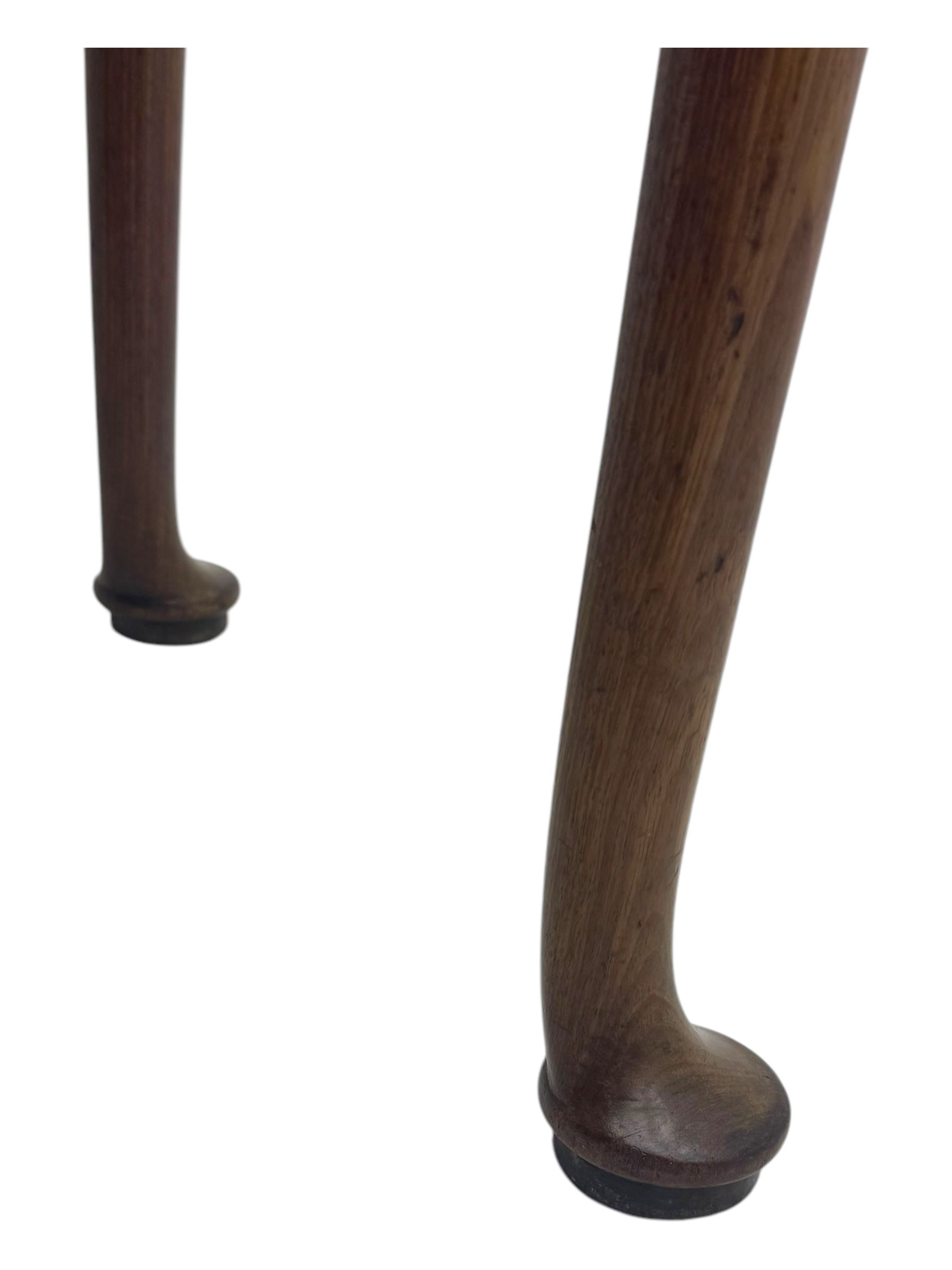 George III mahogany fold-top card table, shaped rectangular top opening to reveal a baize-lined surface, supported by a concertina pull-out concertina rear mechanism, raised on cabriole supports with foliate carvings terminating in pad feet