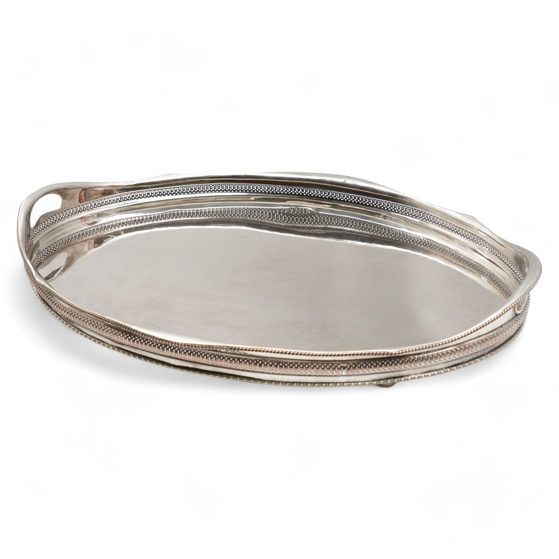 Silver plated oval gallery tray with pierced border and gadrooned edge with integral handles L63cm
