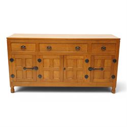Lizardman - oak 5' sideboard, rectangular top over three panelled frieze drawers, fitted w...