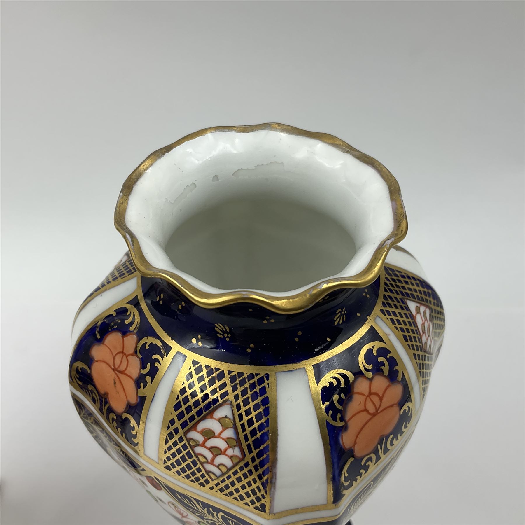 Pair of early 20th century Royal Crown Derby Imari 1128 pattern vases, of tapering straight sided form with waisted neck and frilled rim, upon four splayed feet, with printed and painted marks beneath including illustration date codes for 1911 and 1920, H17cm