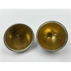 Modern silver limited edition Easter egg, no. 70/500, the gilded body decorated in relief with silver latticework and a band of flower heads, the detachable cover opening to reveal a gilt interior, each hallmarked St James House Company, London 1978, H5.5cm