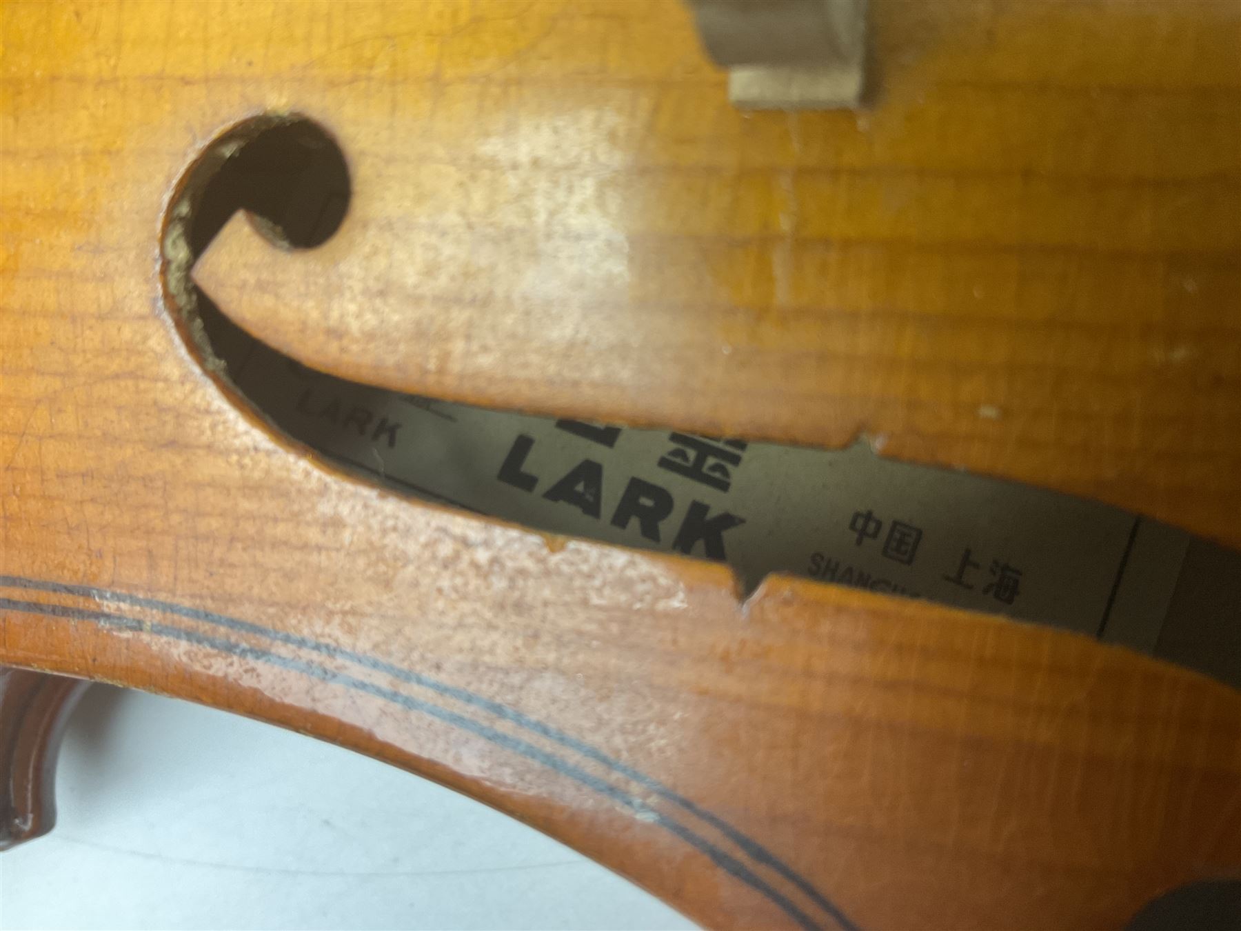 Four Chinese graduated violins - full size with 35.5cm two-piece back; three-quarter size with 33.5cm two-piece back; half size with 31cm two-piece back; and quarter size with 27.5cm two-piece back; all cased except full size; one with bow (4)