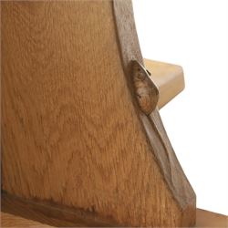 Mouseman - circular adzed oak circular dining table, on quatriform base with carved mouse signature, by the workshop of Robert Thompson of Kilburn