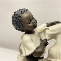 Giuseppe Armani Florence figure, Black Maternity, modelled as a mother and child upon a stylised cloud and mahogany base, H32cm