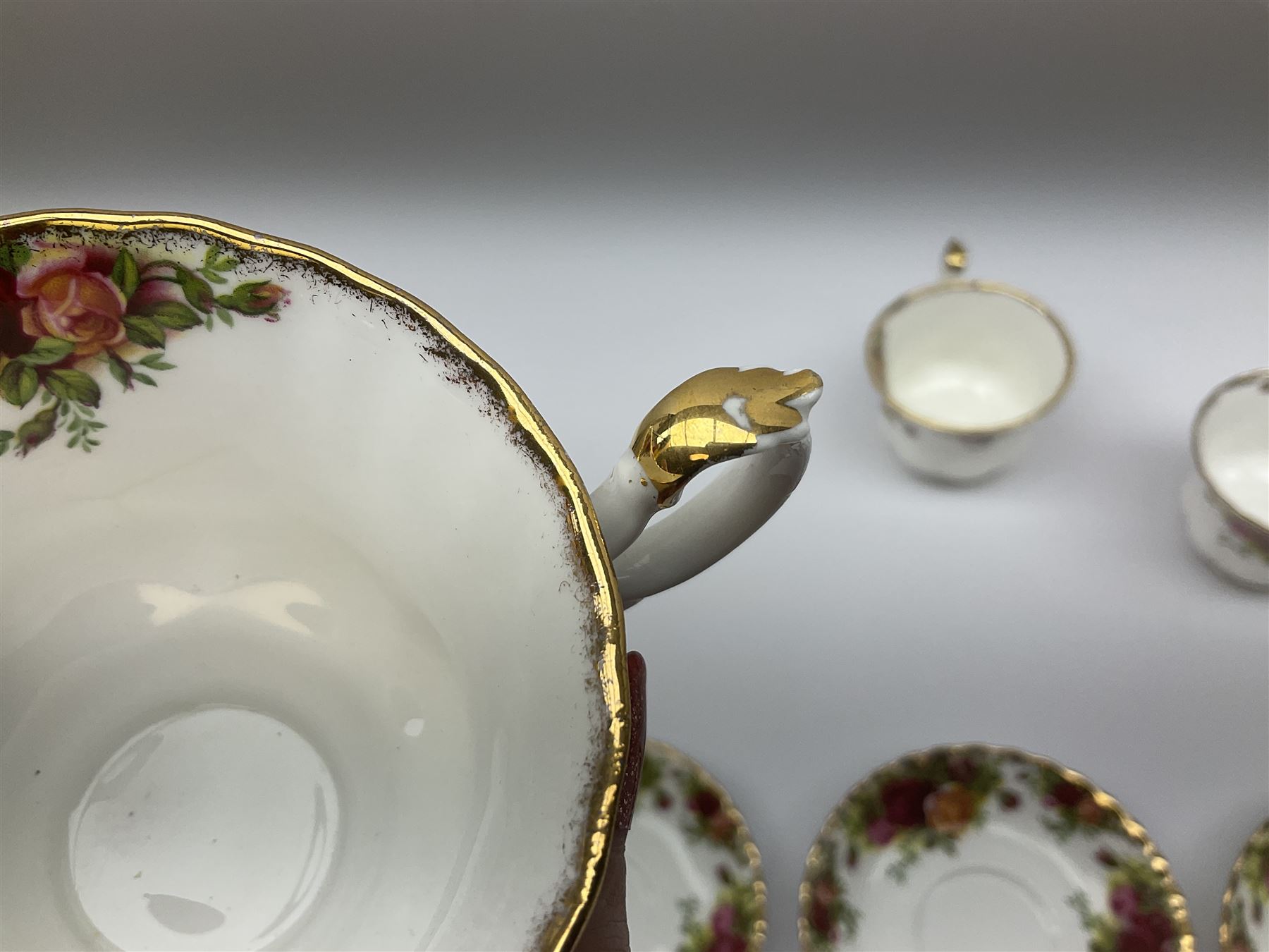 Royal Albert Old Country Roses pattern tea set, comprising teapot, coffee pot, six teacups and six saucers, five side plates, further teacup with joined saucer and side plate, open sucrier, milk jug, cake plate, and preserve pot and cover, together with Royal Albert Jubilee Rose pattern sauce boat and stand, and Royal Albert Lavender Rose pattern cake stand. 