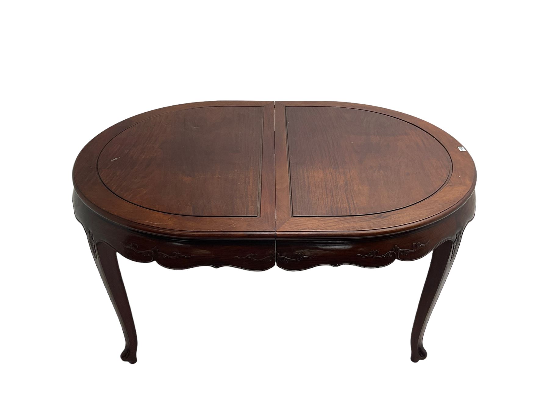 Mid to late 20th century Chinese hardwood extending dining table, two additional leaves, shaped apron carved with foliate scrolls, leaf carved cabriole supports (W246cm, H78cm, D117cm), and set six (4+2) dining chairs with shaped cresting rails over carved splats