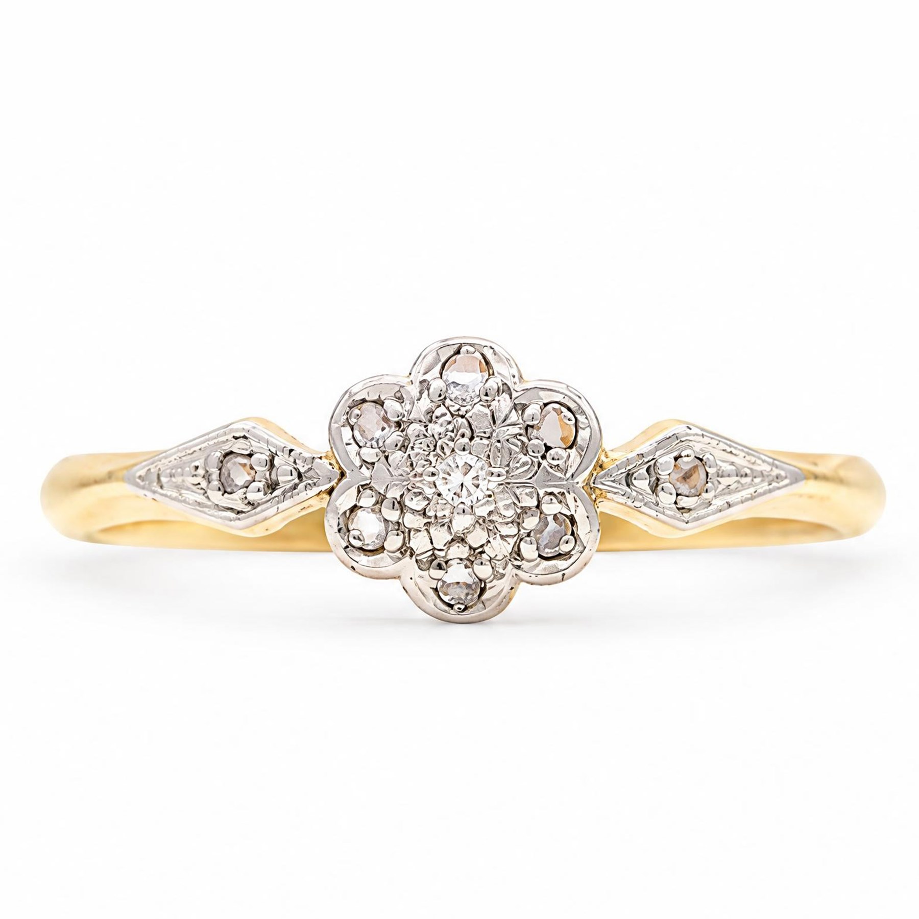 Early 20th century gold diamond daisy flower head cluster ring, set with seven diamond chips and diamond shoulders, stamped 18ct Plat