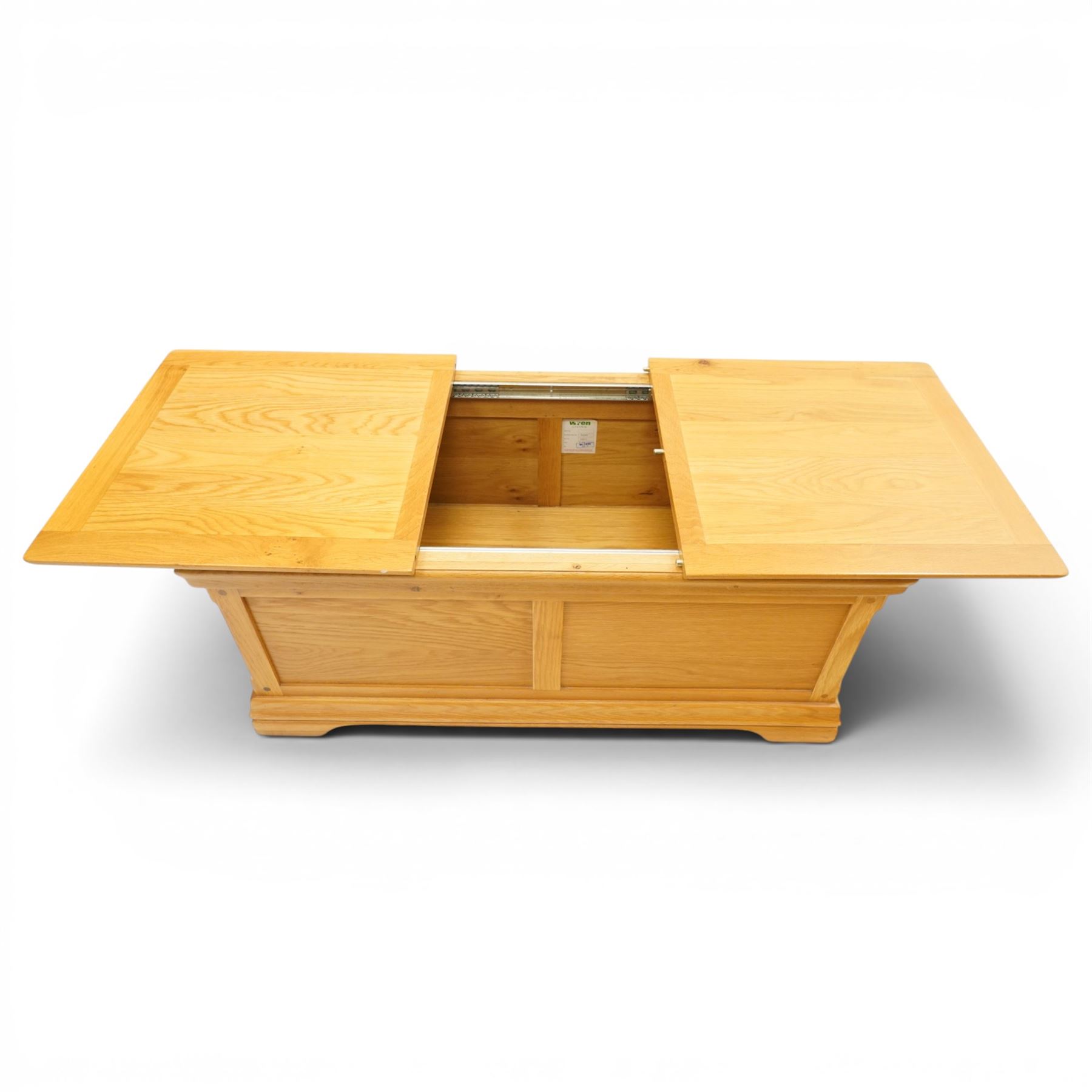 Contemporary solid oak blanket chest, rectangular sliding two-part top on metal runners enclosing storage compartment, panelled front and sides