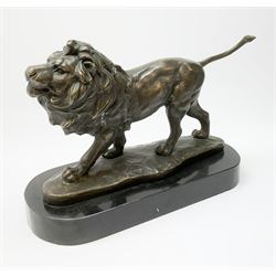 Bronze figure of a lion after 'M. Lopez', raised upon a shaped base, L33cm