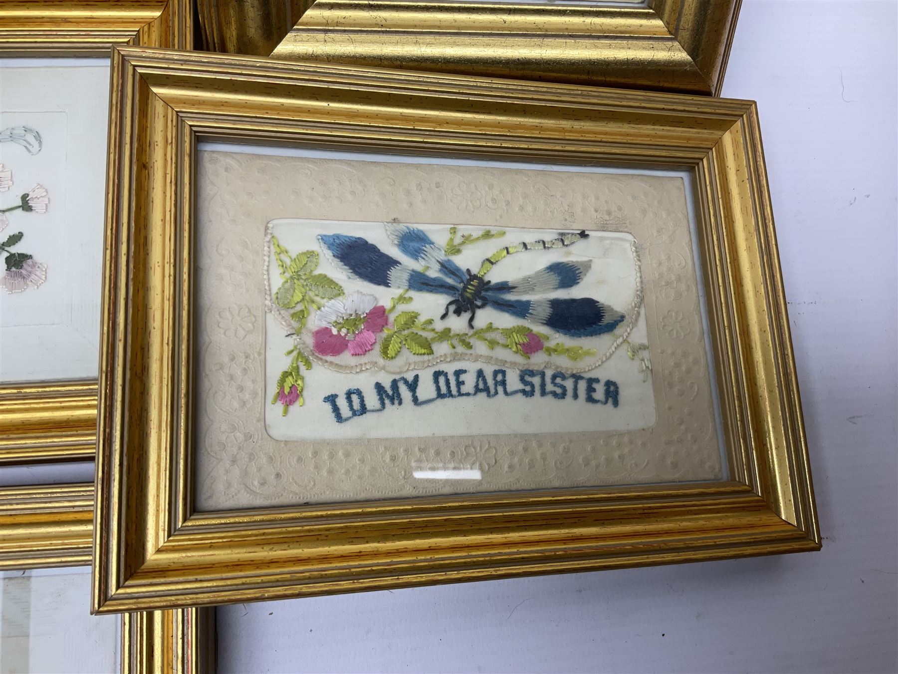 Collection of twenty eight, mostly WWI period embroidered silk greetings cards and postcards, including 'A kiss from France', good luck, sweetheart and Christmas examples, all within modern gilt frames