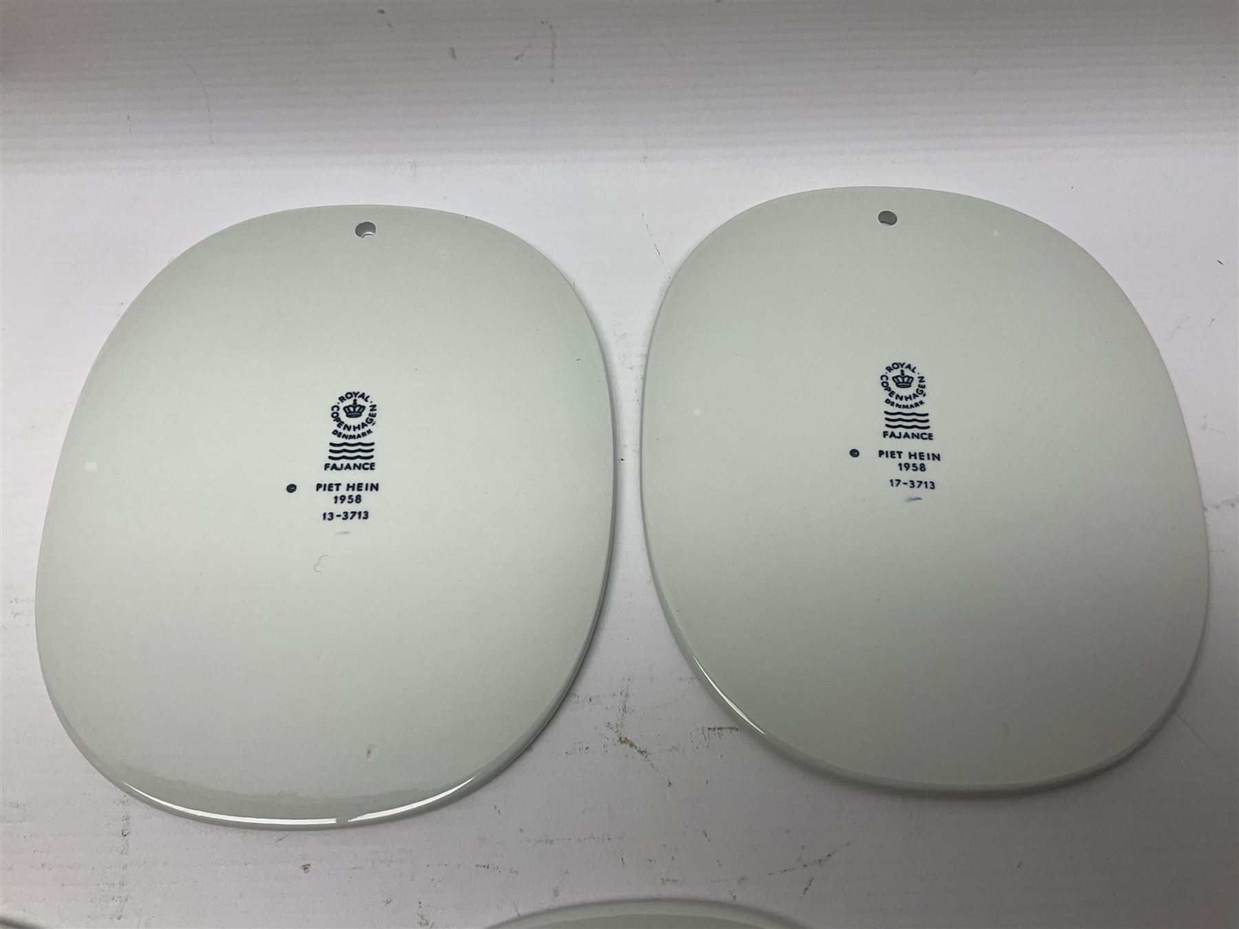 Seven Royal Copenhagen Piet Hein 1948-1980 plaques,all with printed mark to back H17cm