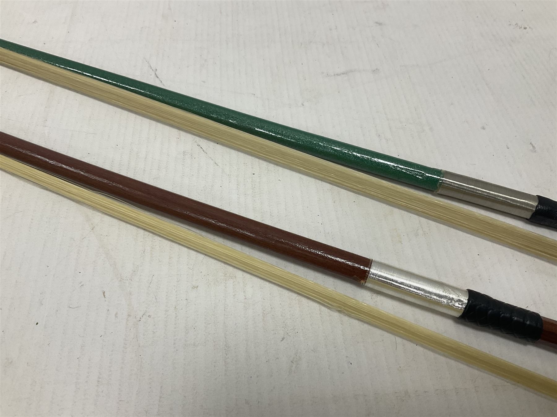 Zest full size pink violin, with a solid wood body and maple head, with matching pink bow and two further bows, in a hard case Length 60cm