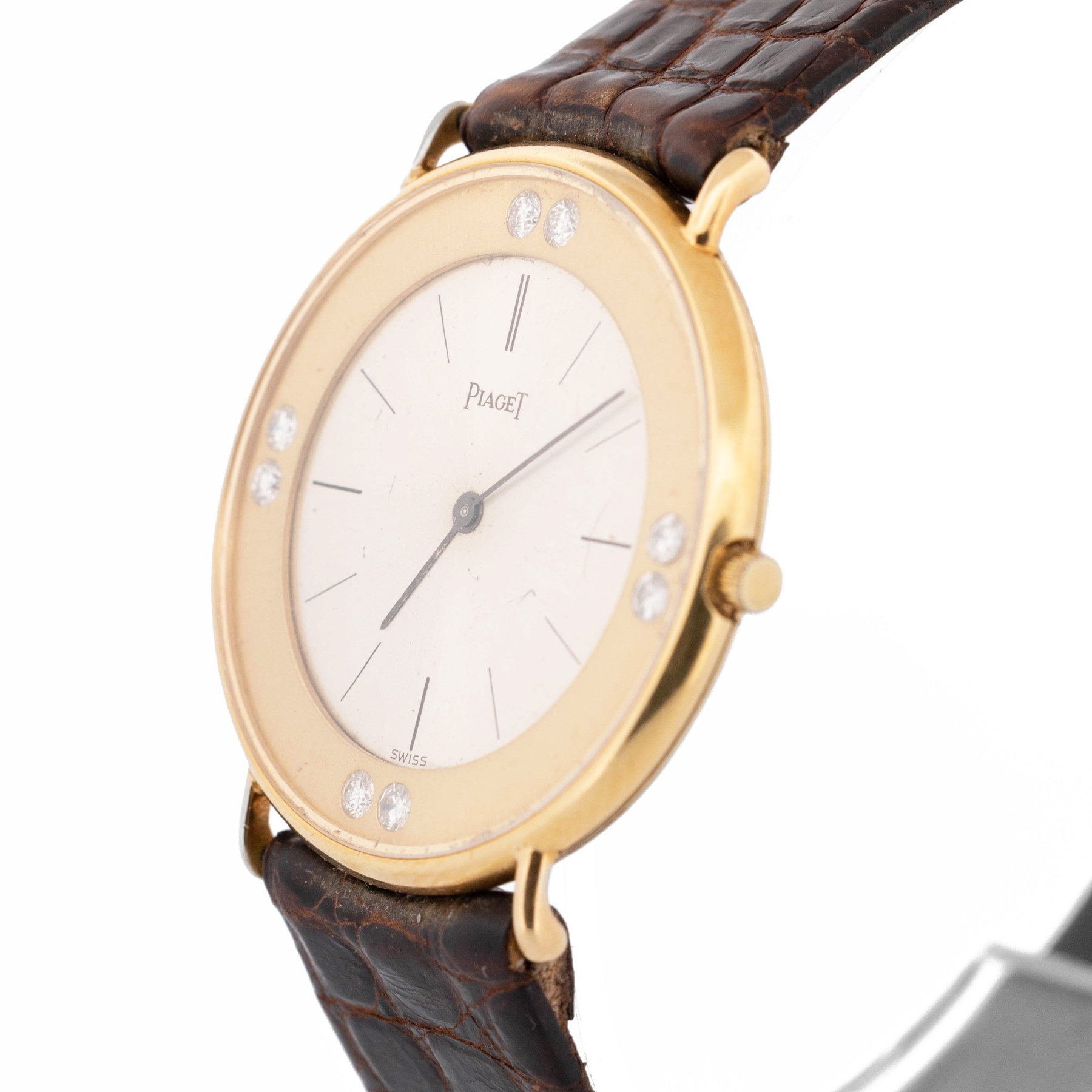 Piaget Altiplano ultra thin 18ct gold diamond set manual wind wristwatch, Ref. 2642, Cal. 20P2, silvered dial with baton hour markers, the gold outer ring set with eight round brilliant cut diamonds, on brown leather strap with Piaget 18ct gold buckle and 18ct gold diamond set spacer