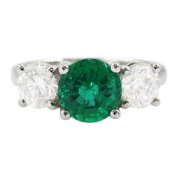 18ct white gold three stone emerald and round brilliant cut diamond ring, hallmarked, tota...