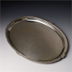 Silver oval tray with gadrooned and floral moulded border W36cm, marked Silver but tests a...