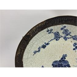 20th century Chinese blue and white crackle glaze charger, decorated with peonies, prunus blossom, and rockwork, within simulated bronze border, with character mark verso, D34cm