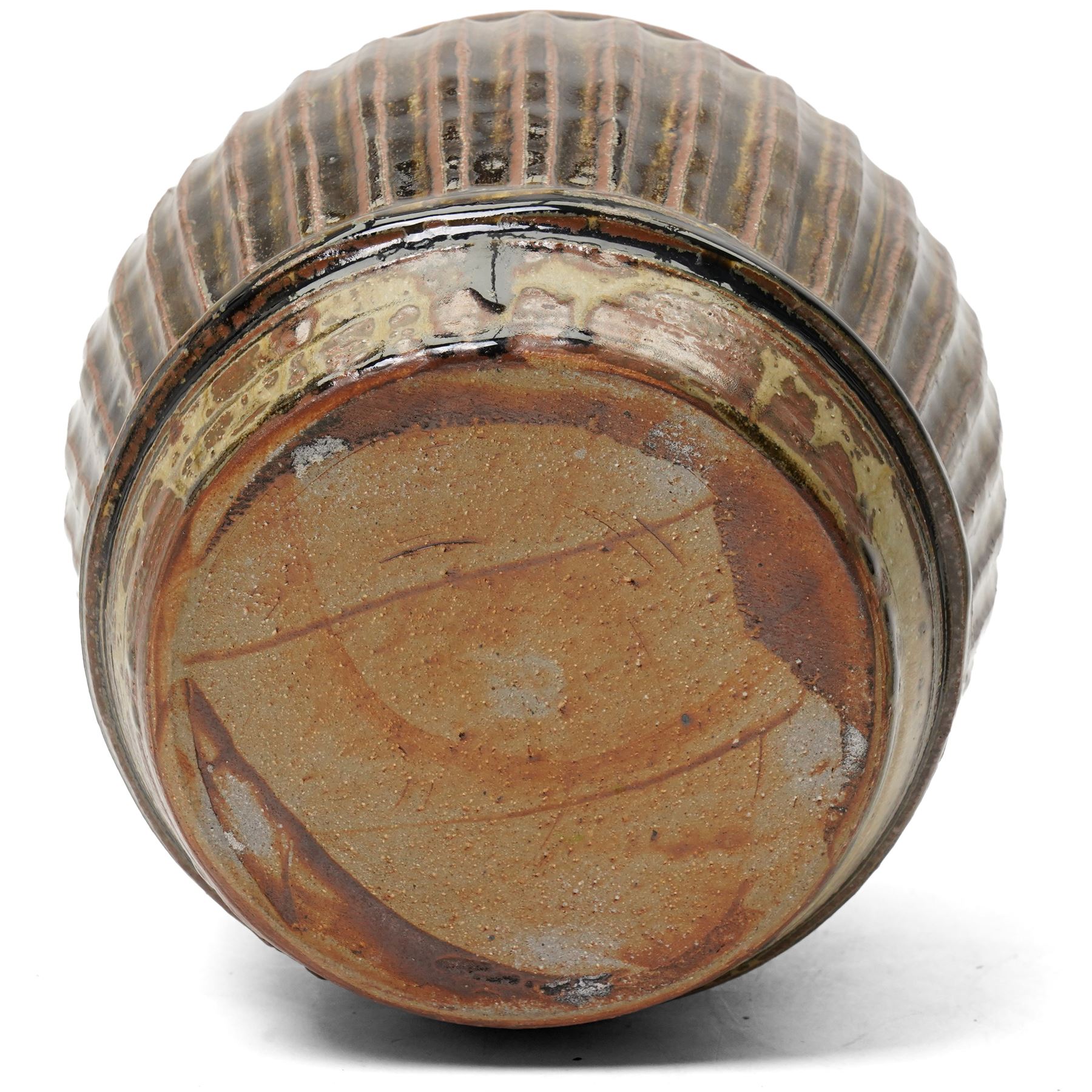 Mike Dodd (1943-): Covered studio pottery storage jar, of fluted barrel form, impressed marks to foot, H20cm 