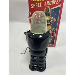 Three vintage battery operated robots comprising tin-plate Space Walk Man ME 100 Robot, Saturn the 13