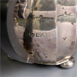1930s silver three piece tea service, comprising teapot, milk jug and open sucrier, of oval form, the teapot with ebonised handle and finial, hallmarked S Blanckensee & Son Ltd, Chester 1931