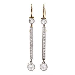 Pair of Art Deco platinum and gold, milgrain set old cut diamond pendant stud earrings, total diamond weight approx 0.70 carat
