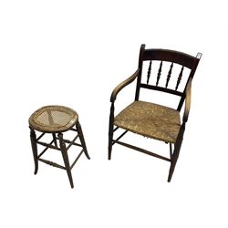 Late 19th century beech spindle back elbow chair with rush seat (W52cm); and a late 19th century beech stool with cane-work seat (H52cm)