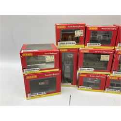Hornby 'N' gauge - eighteen Lyddle End trackside buildings including The Old Toll House, Electricity Sub Station, Teesdale bakery, Mason's Arms Pub, various shops and hairdressers, farm buildings, Clock Tower etc; all boxed; and five Lyddle End blister pack cards of trackside accessories including Lamp Huts, Tractors, War memorial etc (23)