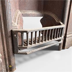 Late Victorian cast ion bedroom fireplace, decorated with floral poppy motifs and flluting