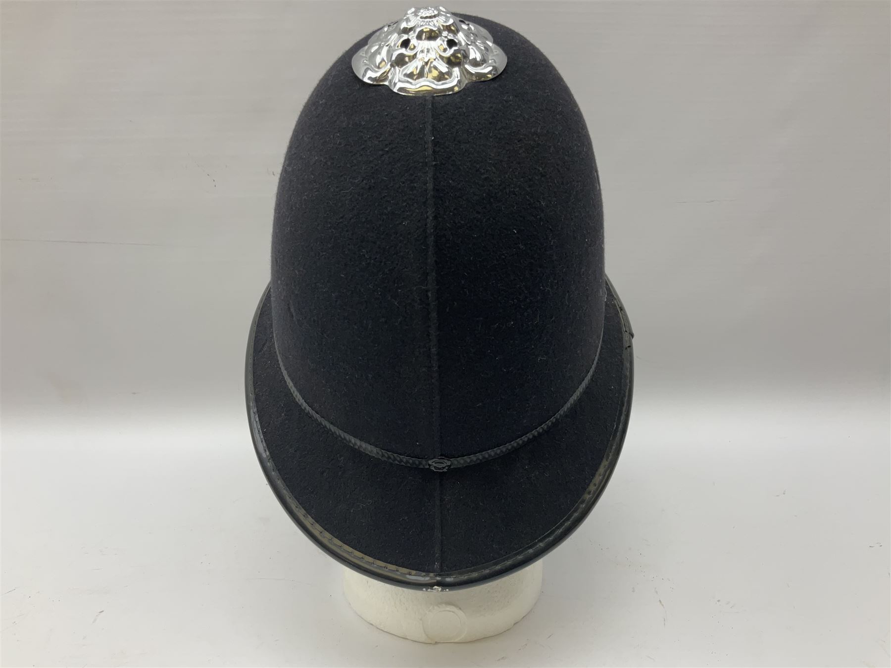 British Transport Police Custodian helmet with Queen's Crown plate; Hiatt & Co ebonised hardwood patrol truncheon; and pair of Hiatts 1960 hand-cuffs (3)