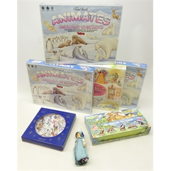  Four Tom Smith Crackers containing Wade whimsies, unopened, set of Wade 'The Dinosaur Collection' whimsies in original box, small composite doll and a Disney 101 Dalmatian collectors plate (7)  