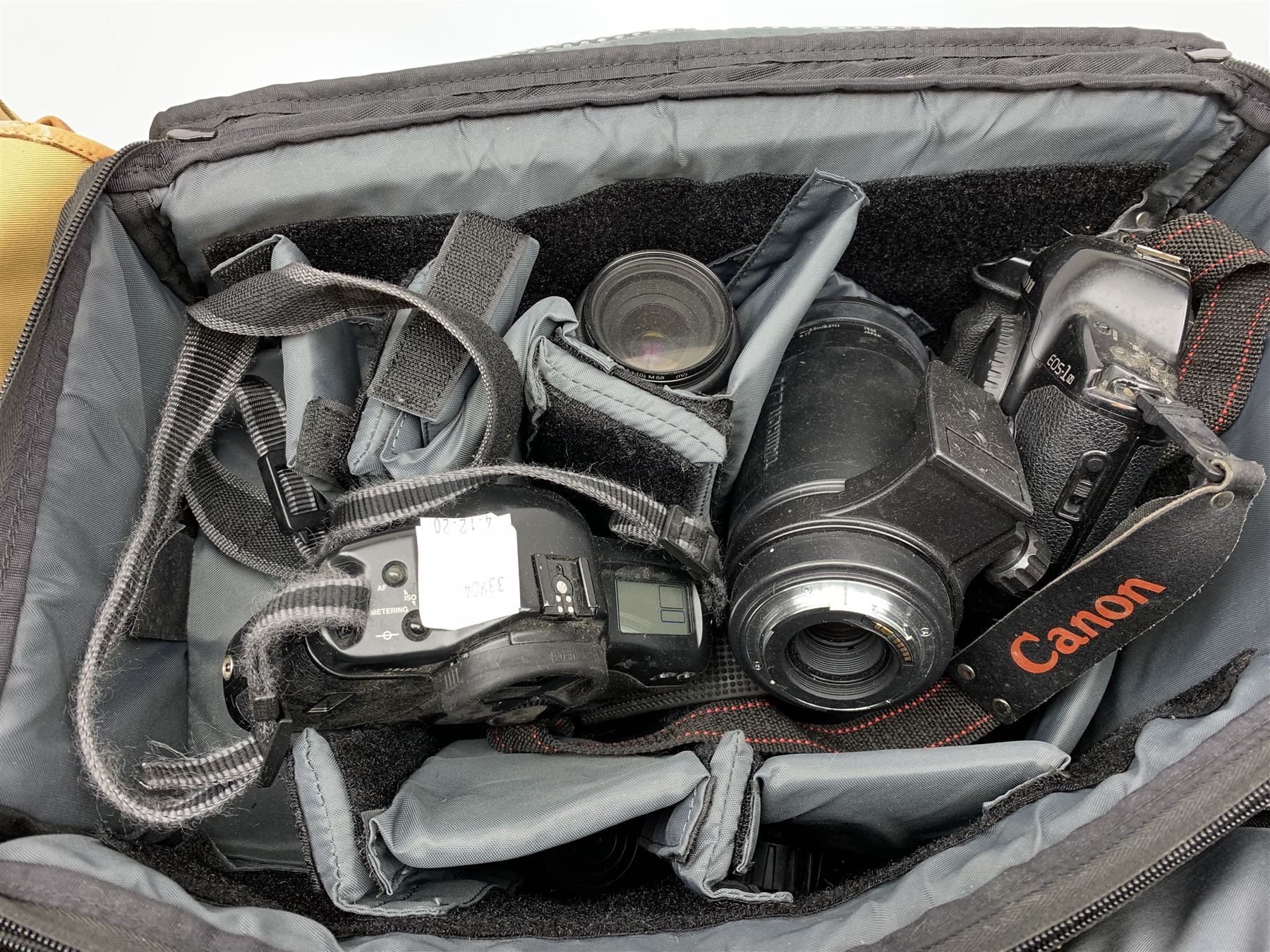 Canon EOS-1 camera body, Canon EOS-1N camera body, Tamron and Sigma camera lenses, two tripods, camera bags and various other accessories 