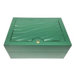Rolex green leather box, with decorative pleated panel to cover, opening to reveal cream velvet interior, the inside lid stamped Rolex with gilded crown logo, printed mark beneath 'Rolex SA Geneve Swiss 39139.64, together with Rolex note paper in box, box H7.7cm