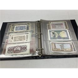 World banknotes, including Queen Elizabeth II The States of Jersey one pound 'DB202703', five pounds 'BB527762' and ten pounds 'AB651481', reserve bank of New Zealand two dollars '1L3 741894', King George V Straits Settlements one dollar 1st January 1935 'F/83 28924', various Bank of England notes etc, housed in two ring binder albums