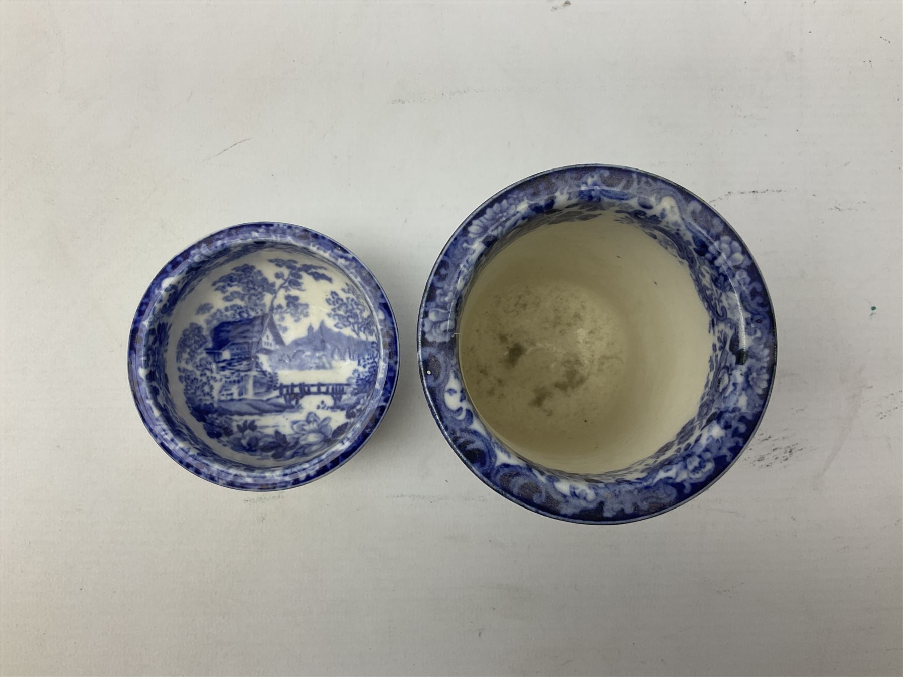 Mintons Genevese pattern wash bowl, jug and toothbrush holder, together with a similar Mintons blue and white soap dish, all decorated in the oriental style, all with printed marks beneath, largest D32cm
